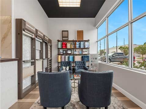 Store interior showcasing several different types of window coverings